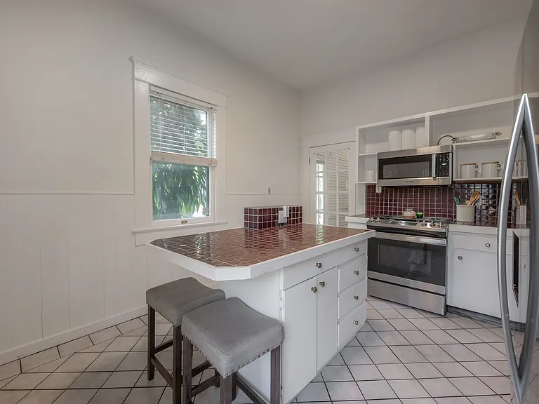 Kitchen with newer appliances and basic kitchen essentials available