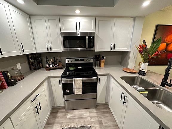Open kitchen with stain steel appliances