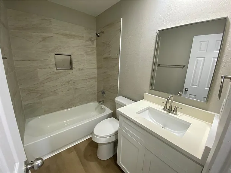 Hall Bath completely renovated with all new fixtues, tile, cabinet and countertop
