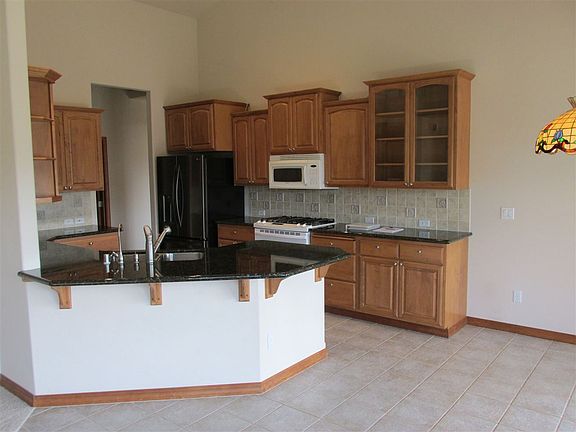 4th image of 13025 E 37th Ct