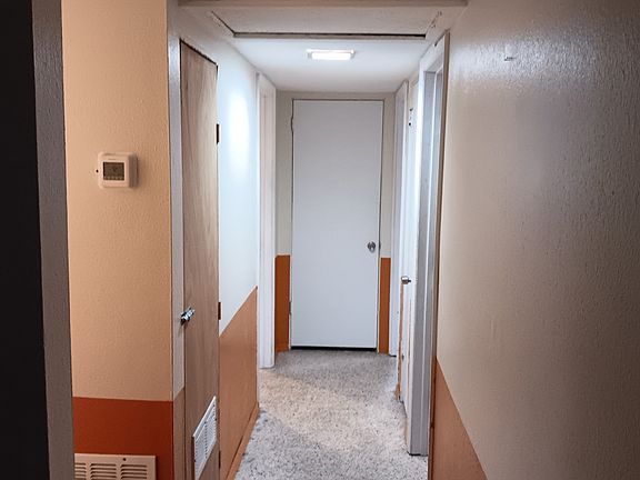 Hallway to bathroom, 2 bedrooms, and master bathroom