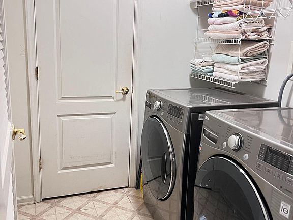 Laundry Room with closet