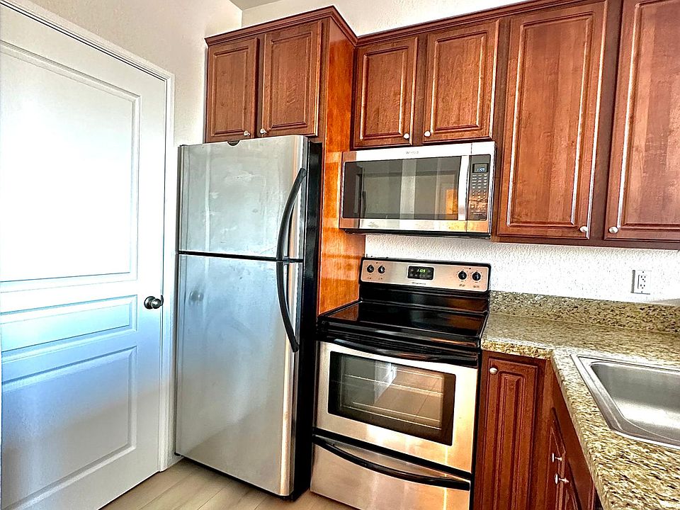 Kitchen with granite countertops and stainless appliances.