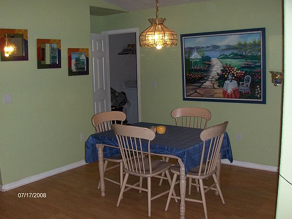 Dining Room with laundry room door behind