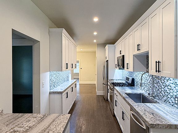 Kitchen
Washer & Dryer located bottom left corner of photo under granite countertop