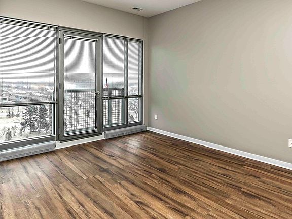 Floor-to-ceiling windows reveal amazing greescape and cityscape views