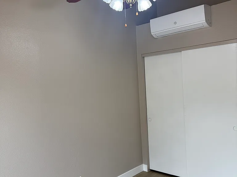 Bedroom #2 with heating and air conditioning unit