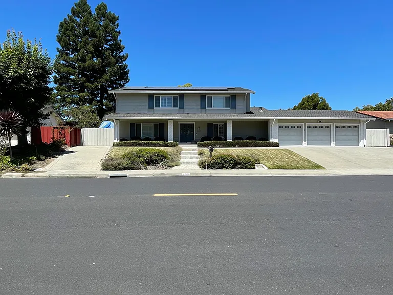 Full front view of the property with 3 car garage, side RV access, plus side auto access.