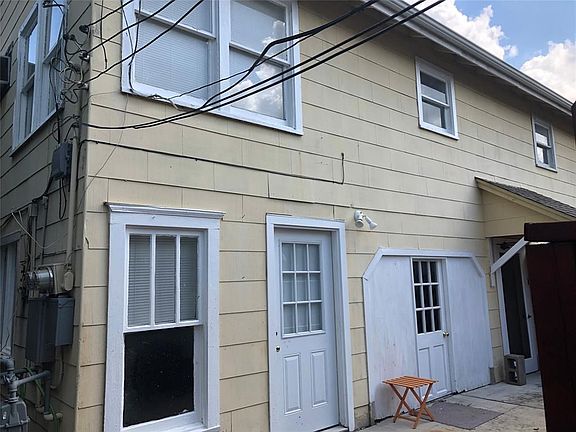 At the end of the pathway is the cottage house. This is a photo of the front door on the left and the door on the right is to a 