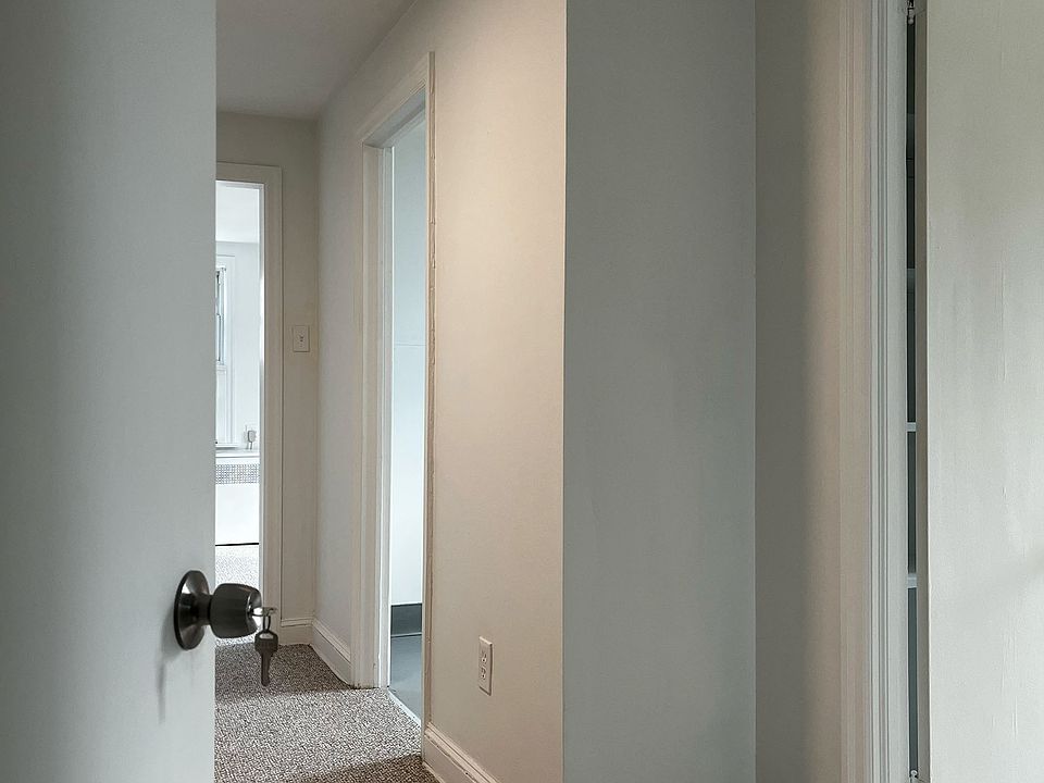 as you open the apartment door at the top of the stairs