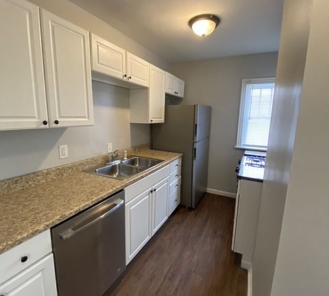 Galley Kitchen with Stainless steel appliances