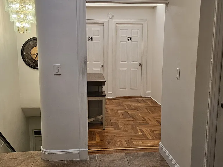 Looking towards downstairs exit and Rooms entry.