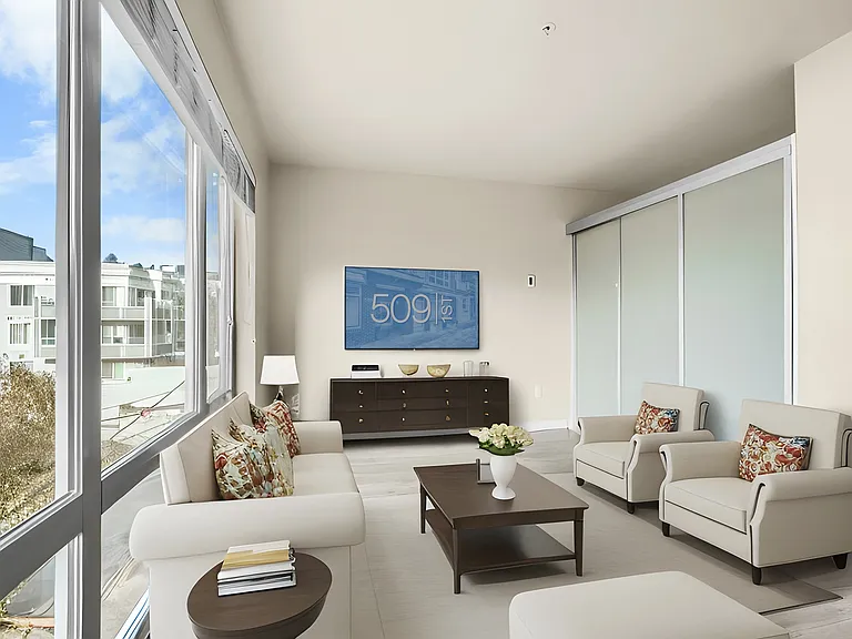 Wraparound windows bathe this corner living room in light.
