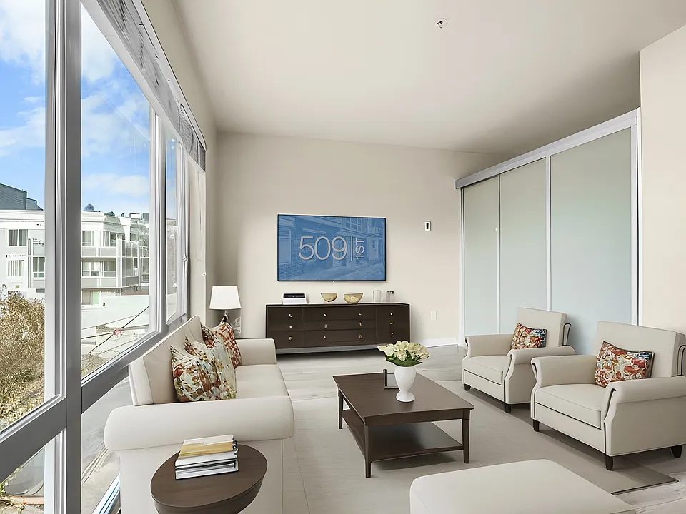 Wraparound windows bathe this corner living room in light.