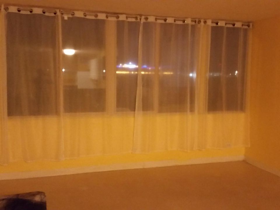 Photos taken at night. Living room facing the Harbor.