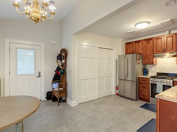 New porcelain tile floors, lots of light and new kitchen