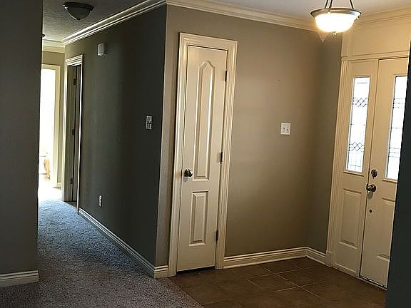 Front door, coat closet