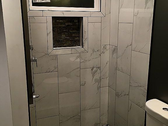 the beautiful tiled shower!