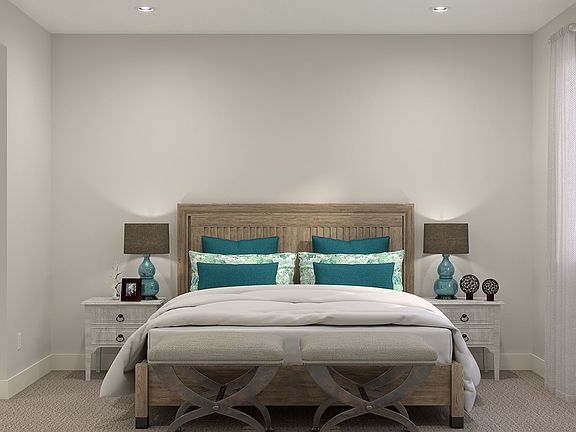 The Primary Bedroom enjoys a private space at the back of the home with an en-suite bathroom and wal