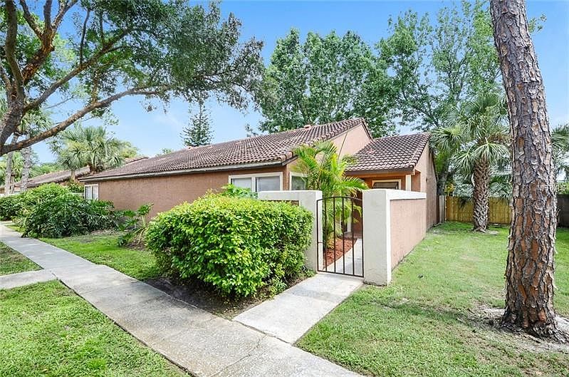 End unit tucked in the middle of two streets providing quiet and privacy.