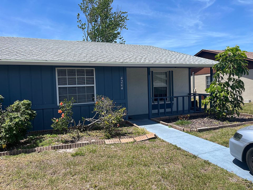Front of duplex with covered patio