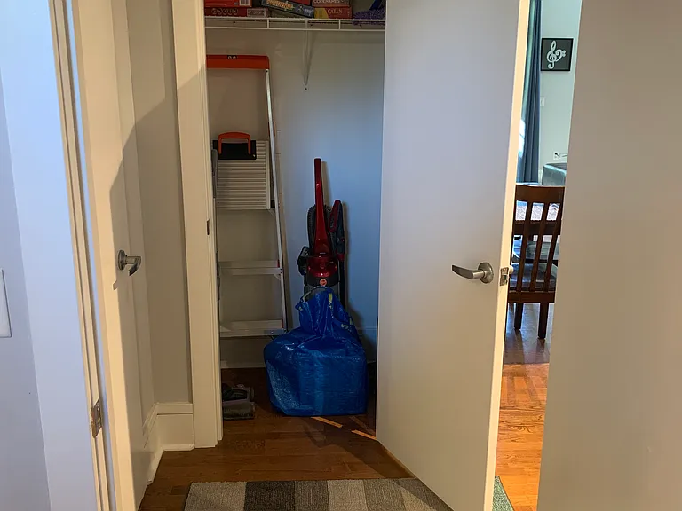 From the 2nd bedroom looking into the hallway and a look at the coat/storage closet