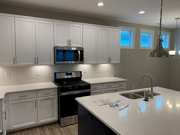 The Tucker 629 Midnight Moon Drive Wendell Falls Herringbone Tile Backsplash