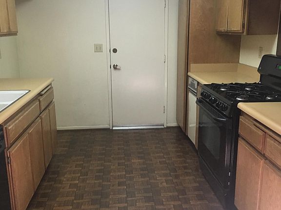 Kitchen,stove,stove overhead light & exhaust fan,dishwasher,trash compactor. Door to attached