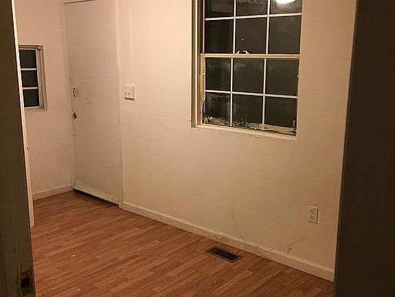 Private Entrance door open to Room 1/Living Room/Den