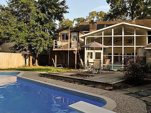 Back (showing Sunroom, Pool, and Fort/Playhouse!