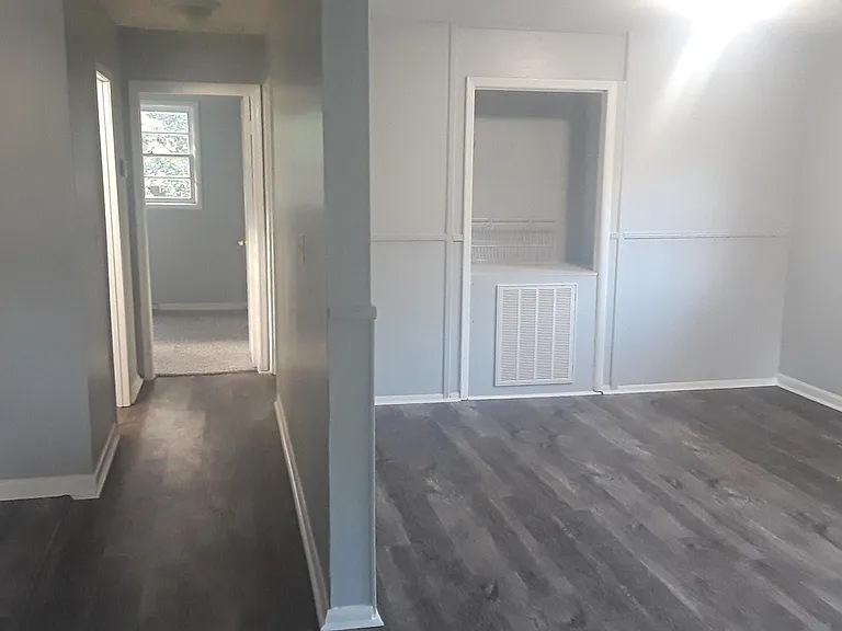 As you walk into the main entrance. Living room on the right, kitchen to your left.