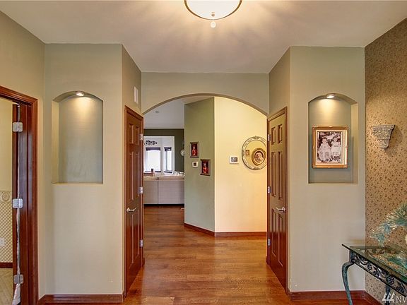 French doors open up to the office / study off the main entry. Access to more storage under the stairway through the small door. 