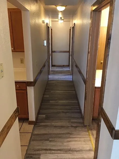 Hallway view, 4 bedroom down hall, 2 each side