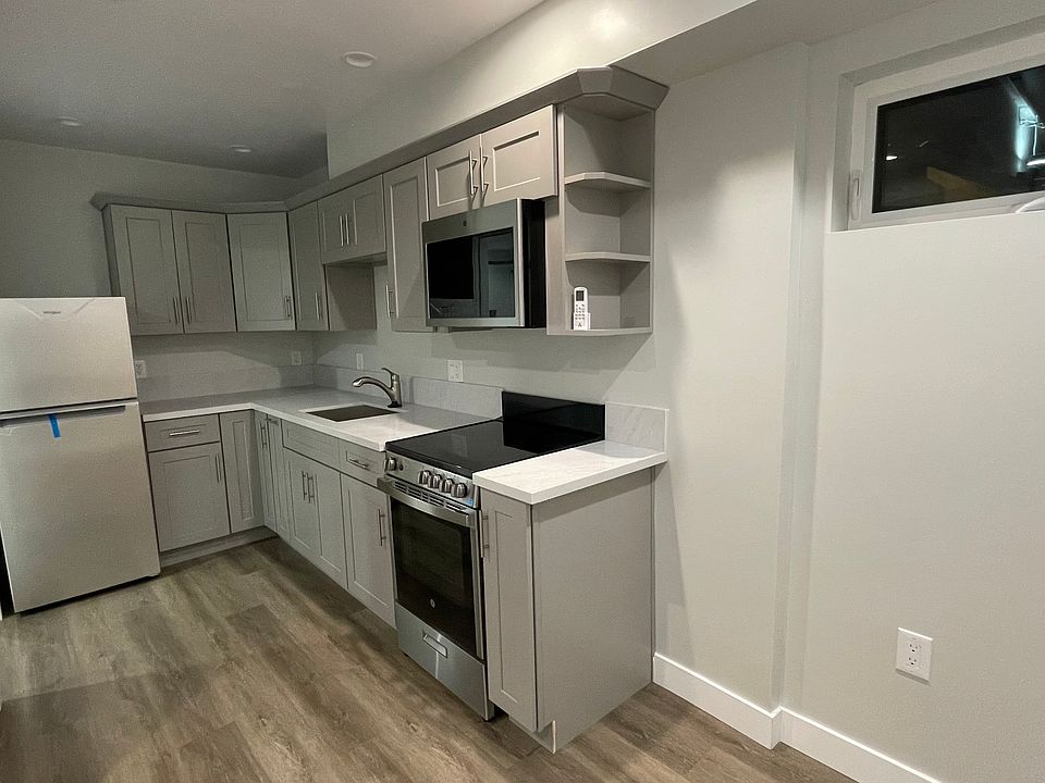 Full kitchen and cabinets.