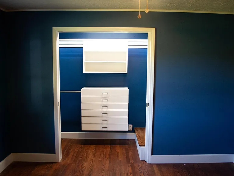 Bedroom 1 with walk-in closet unit.