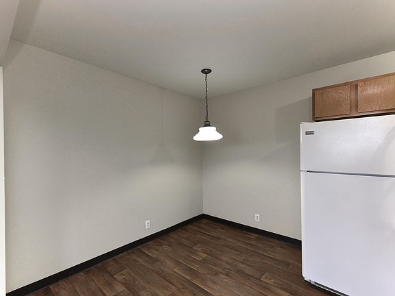 Dining area with hardwood-style flooring