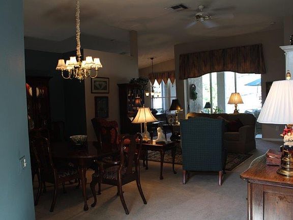 Entryway
						:
						Large living room and dining room looking out onto the pool and lanai.