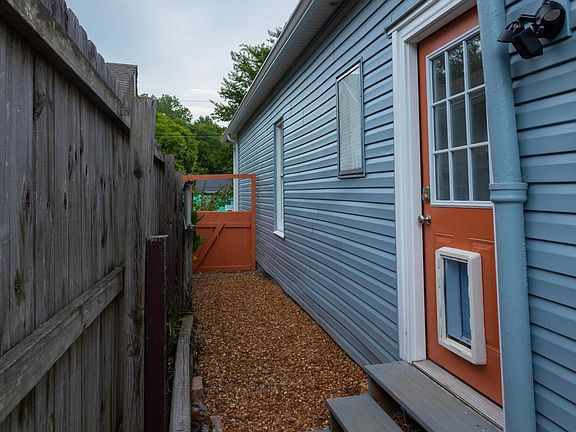 back entry with dog door to fenced yard
