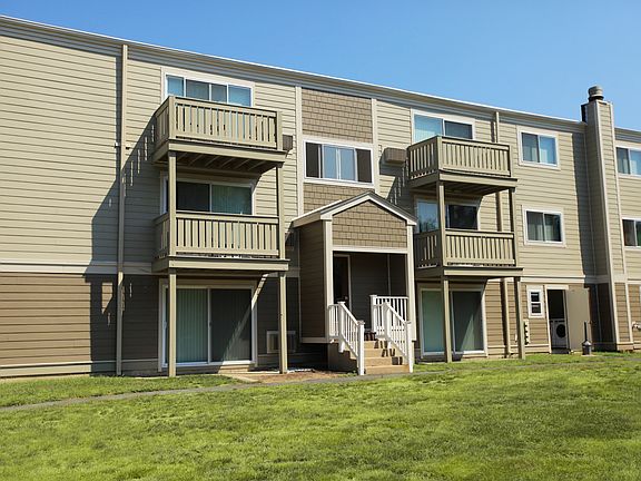 Back of building. Apt has slider/patio off LR/BR space.