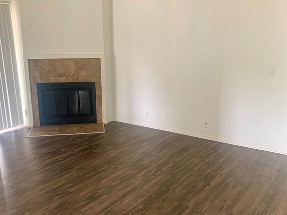 Spacious Living Room with Wood Burning Fireplace