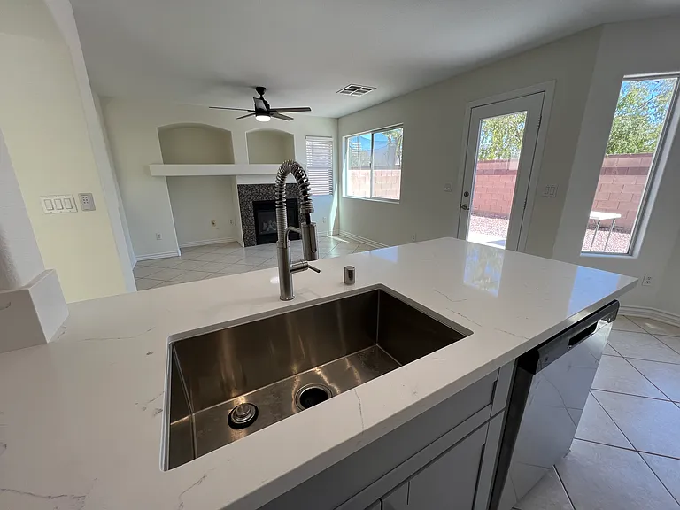 Deep kitchen sink and dishwasher.