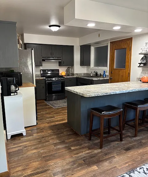 plenty of countertop space and cabinets in kitchen and nice and open concept
