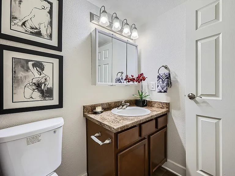 Immerse yourself in the elegance of modern bathroom design, complete with artistic touches.
