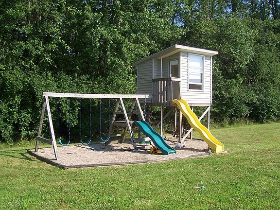 Play house is wired with electricity and comes with swings, slides, firepole.