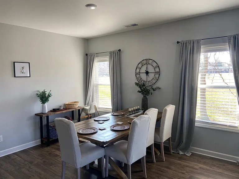 Dining table with four chairs and a bench; seats six comfortably