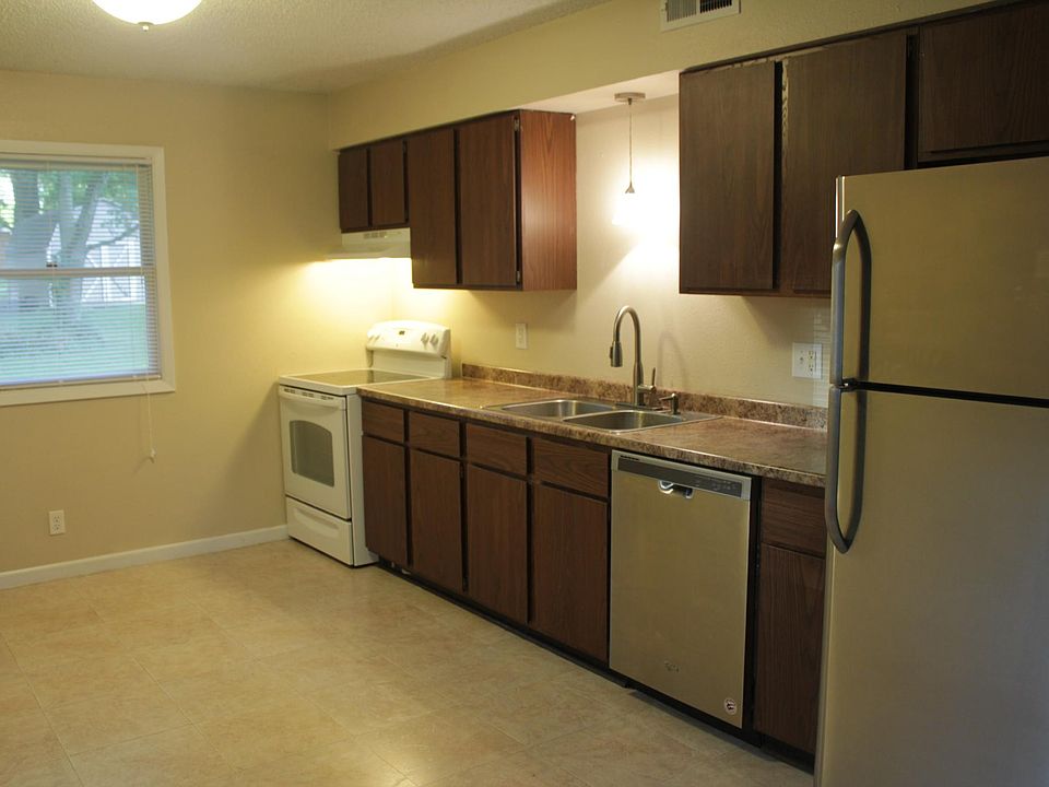 Kitchen includes electric range, dishwasher, refrigerator, garbage disposal