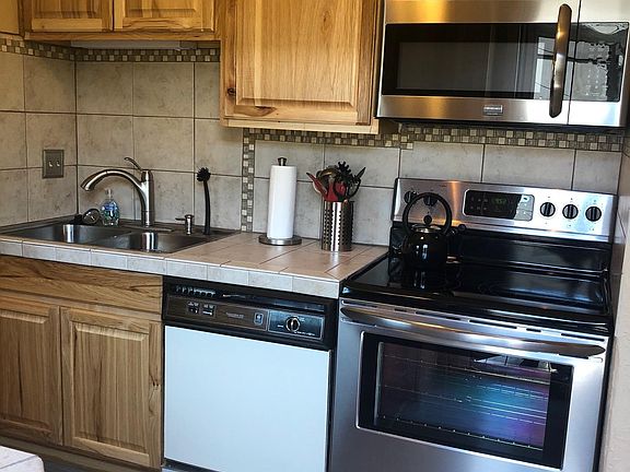 Full sized stove, with air fryer, microwave and dishwasher. Housewares, dishes, and cookware provided.
