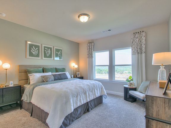 Unwind in the luxurious primary suite.