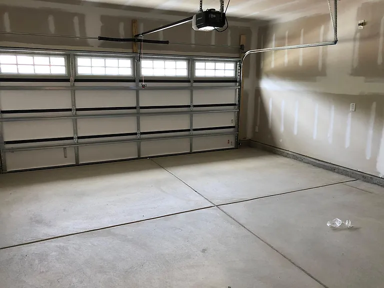 2 car covered garage with 4 additional parking spots on driveway