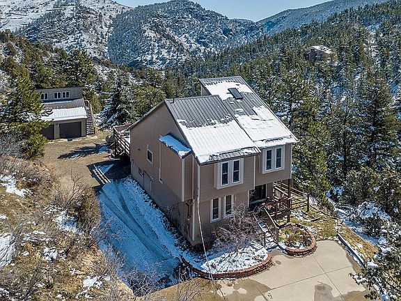 View of west side and garage